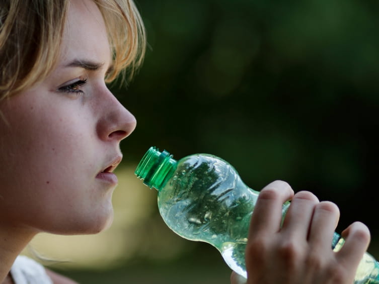 drinking from a bottle