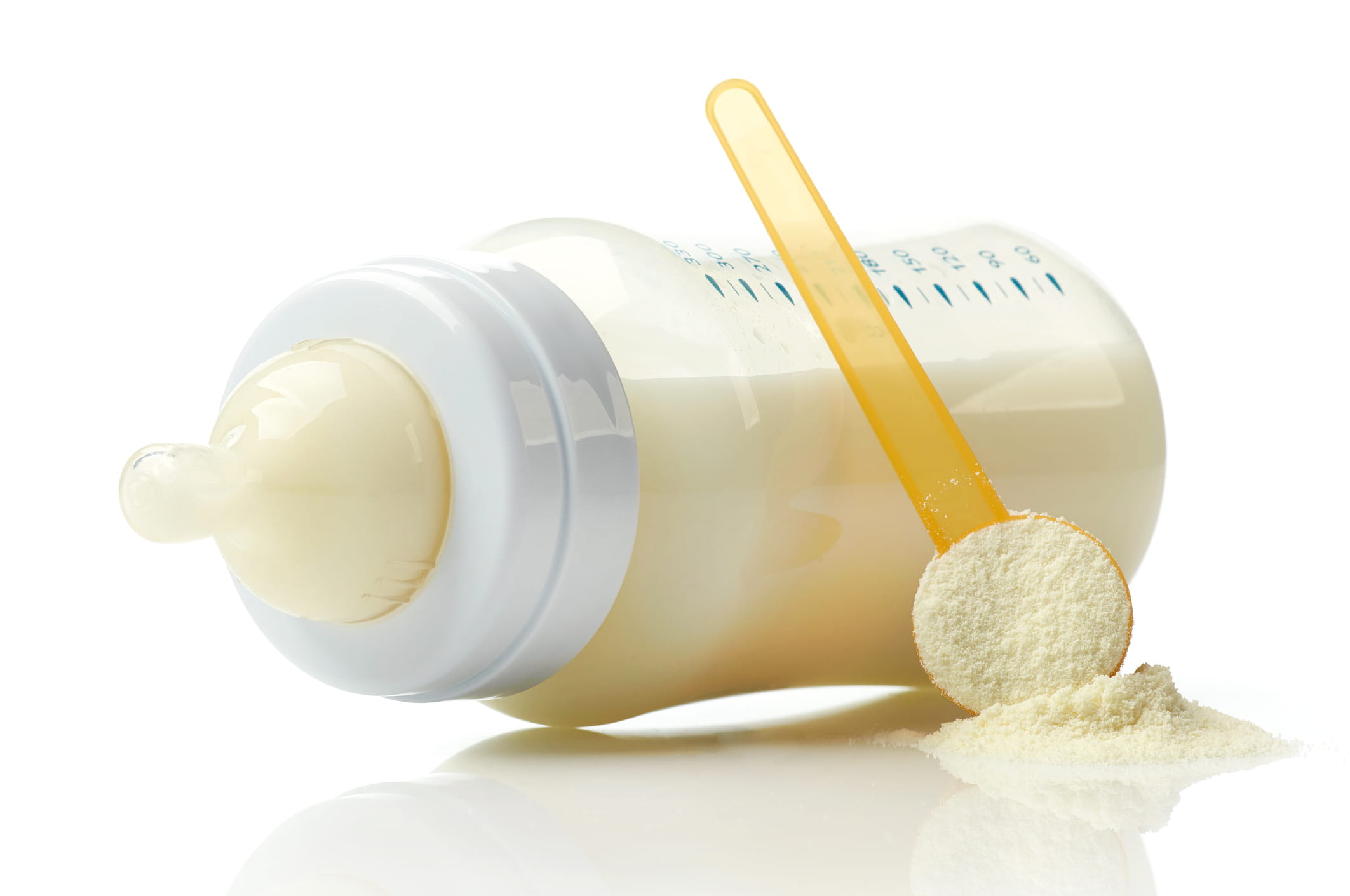 baby milk bottle isolated on white background baby bottle and formula scoop powder
