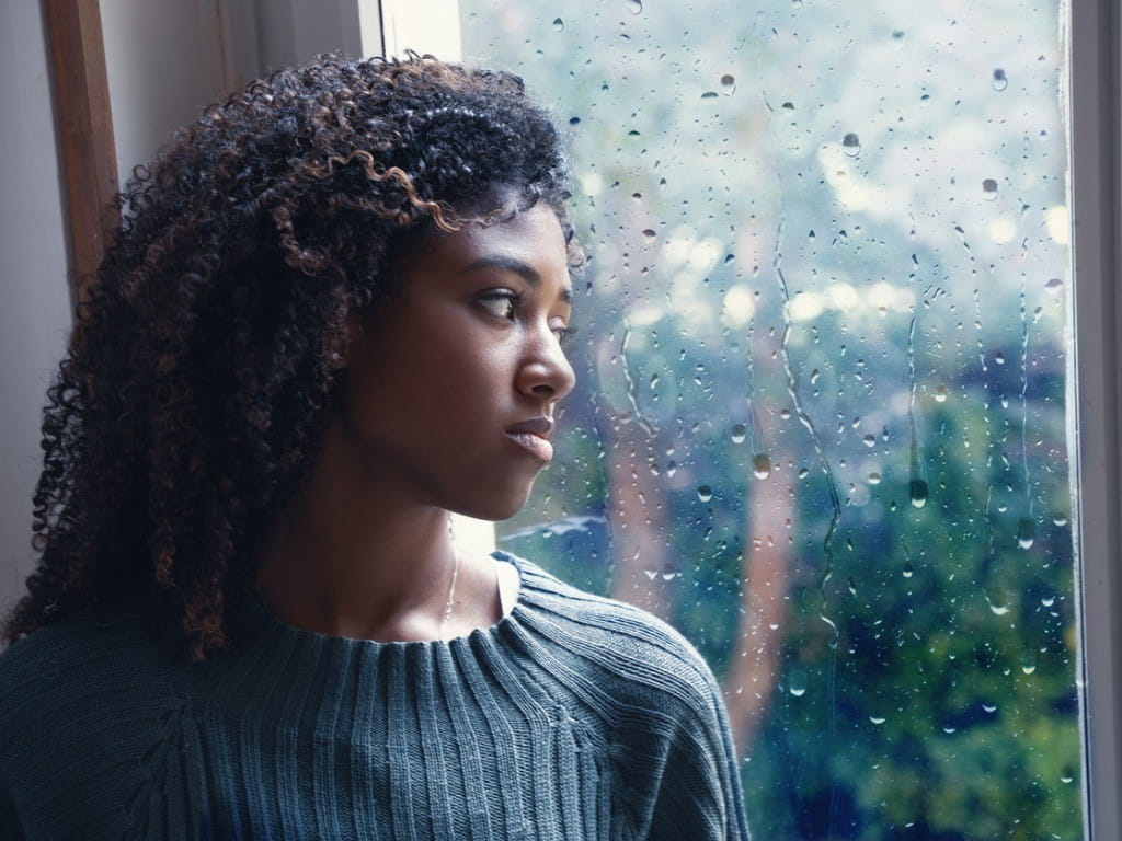 brexpiprazole depressed woman looking out window