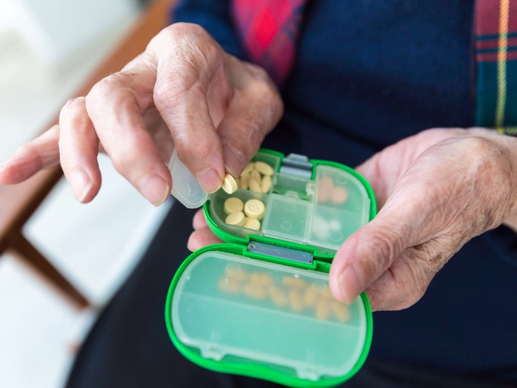 donepezil elderly woman taking alzheimers medication