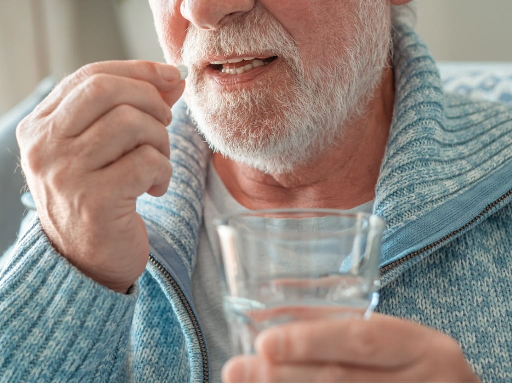 man taking a pill