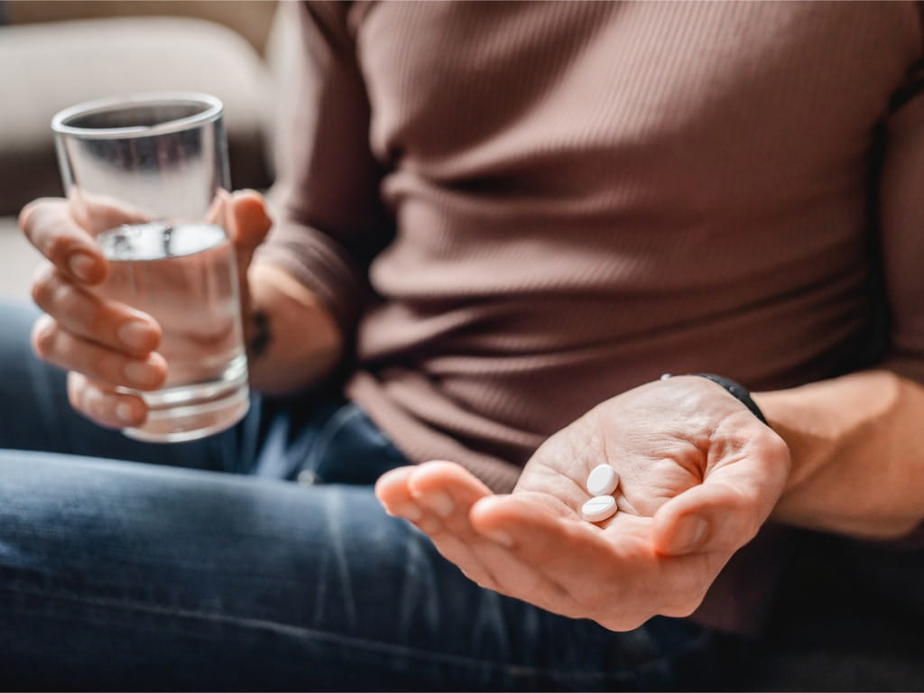 man taking medication