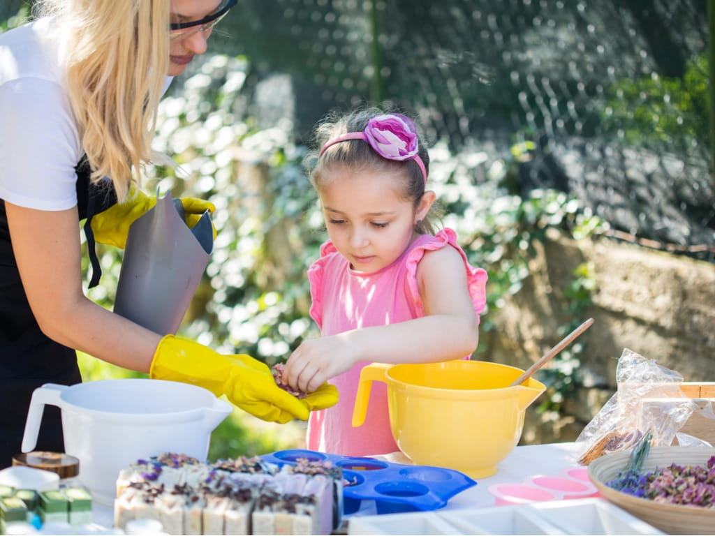 mother and daughter making soap