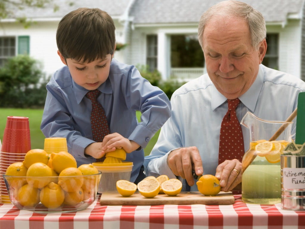 phytophotodermatitis grandfather and grandson cutting lemons for lemonade stand