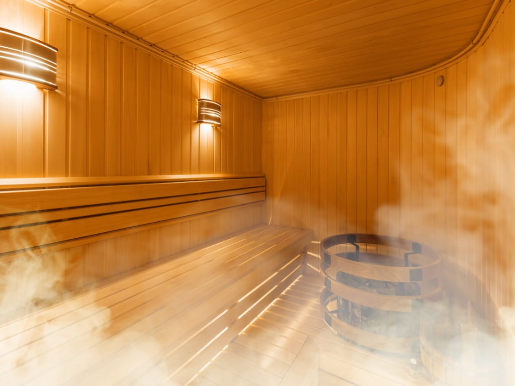 inside of a wooden sauna with steam