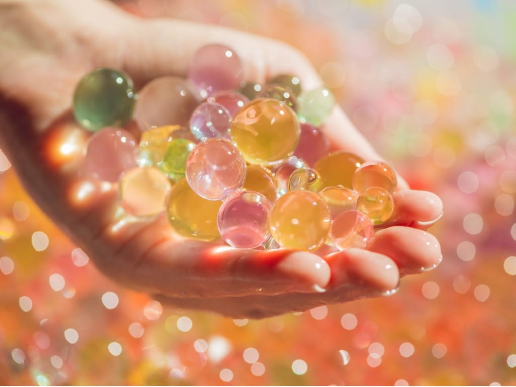 hand holding water beads