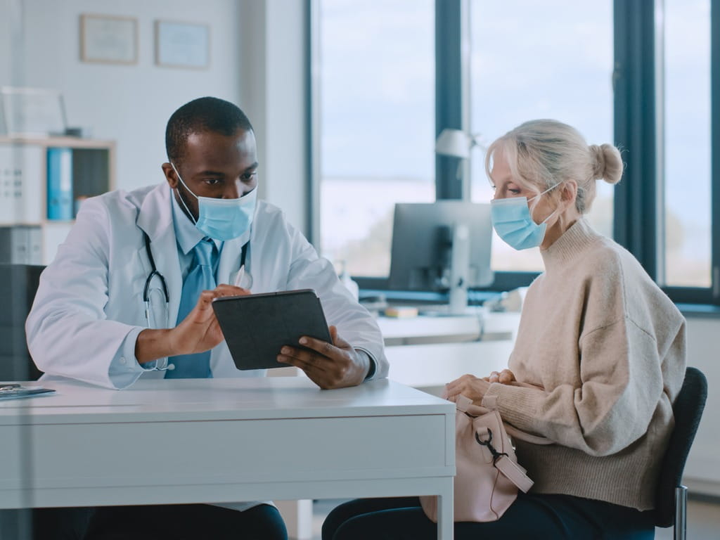 woman speaking with her doctor