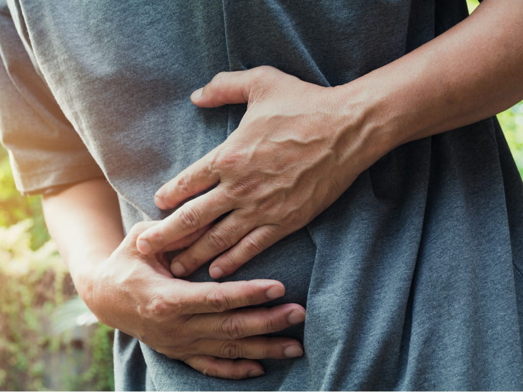 man holding his stomach