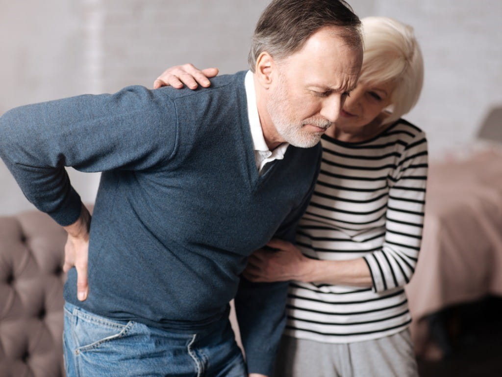 opioid pendulum senior man with terrible back pain